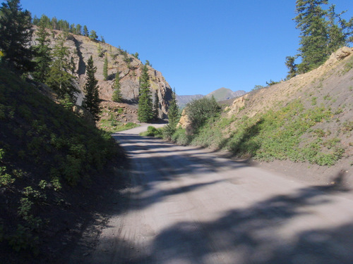 Near the beginning of the dirt road.